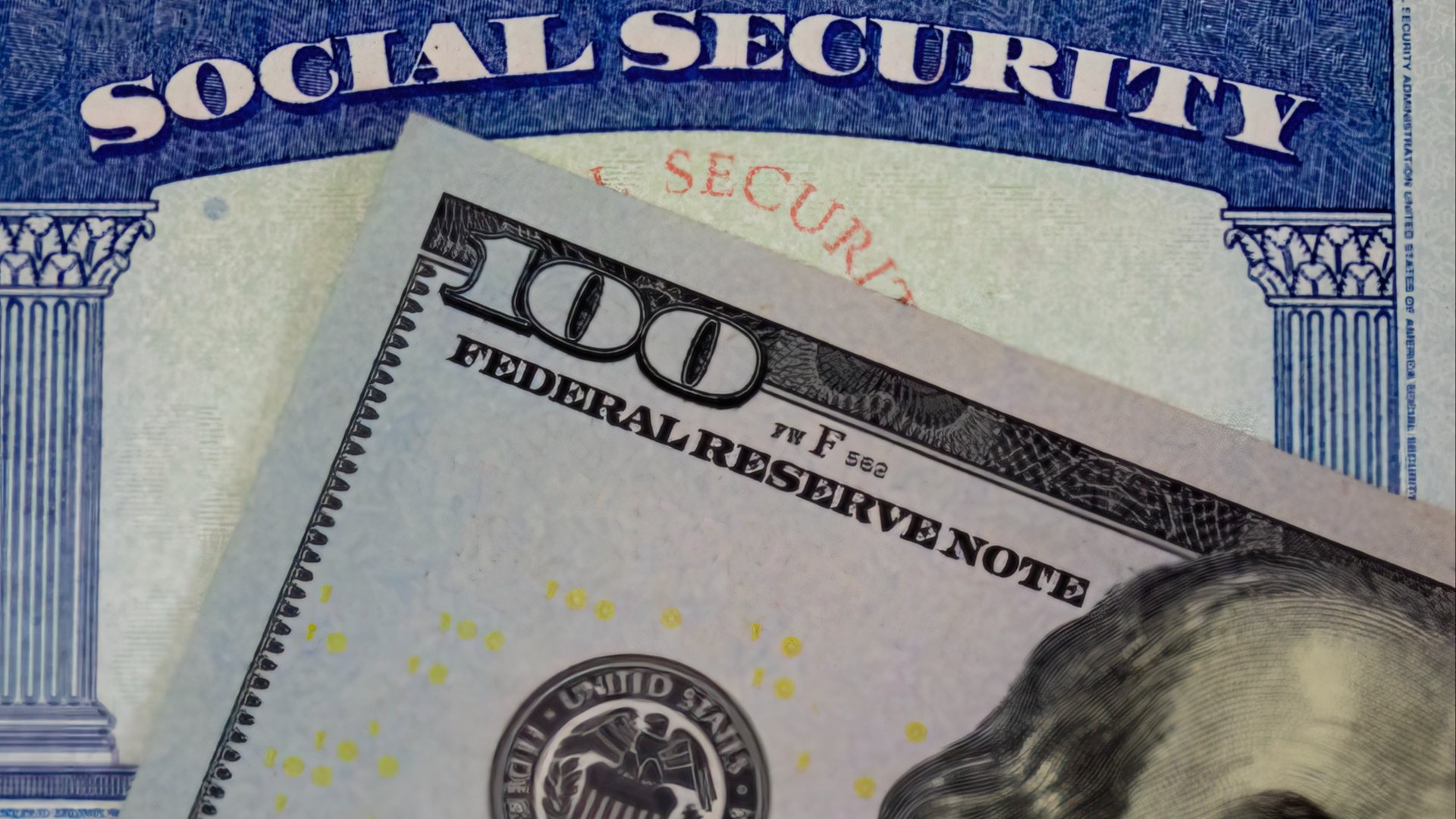 Discover a crisp new $100 bill partially laid over the standard blue and white Social Security card