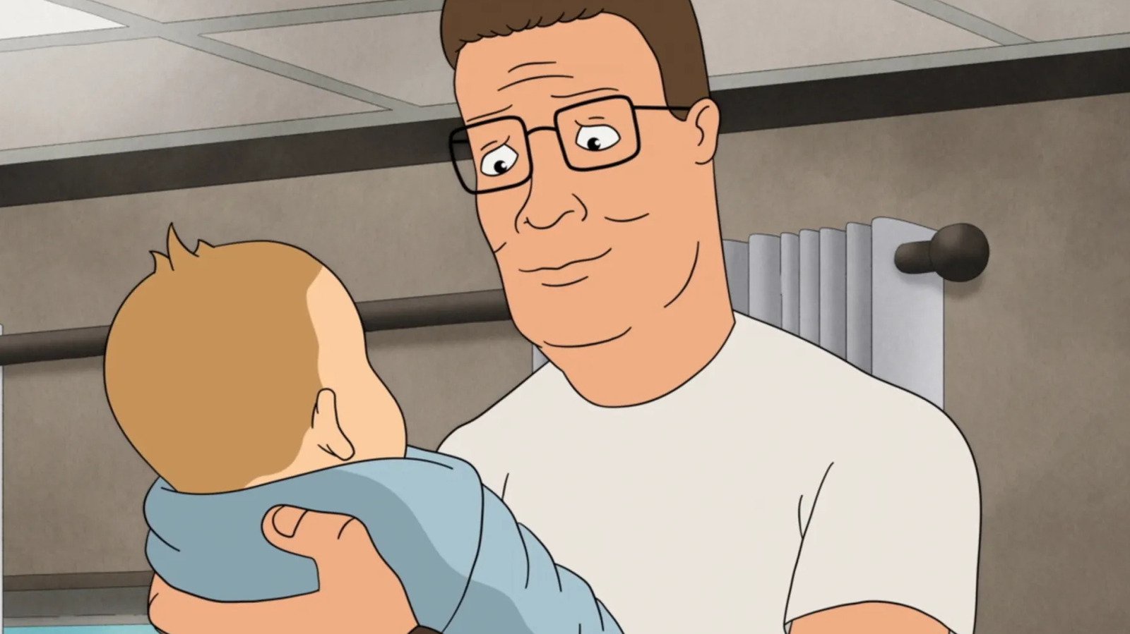 Hank Hill holds baby brother G.H. in "King of the Hill."