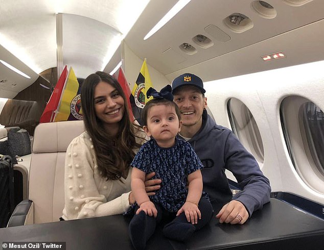 Mesut Ozil arrives in Turkey with his family ahead of his unveiling at Fenerbahce as his seven-and-a-half-year spell at Arsenal finally ends (photos)