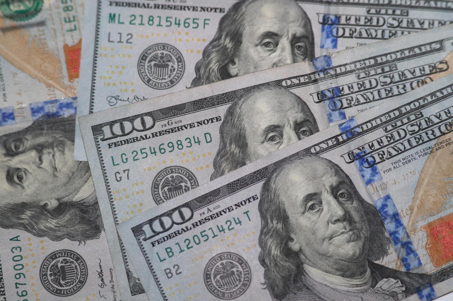FILE – U.S. $100 bills displayed for a photo in Dallas on Jan. 22, 2020. (AP Photo/LM Otero, File)
