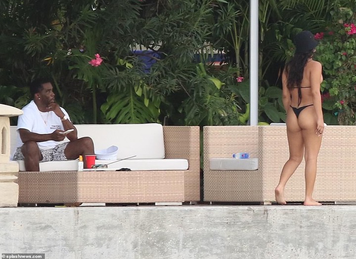 P. Diddy spotted with another mystery woman at his Miami Beach mansion few days after he was pictured kissing model Tina Louise (Photos)