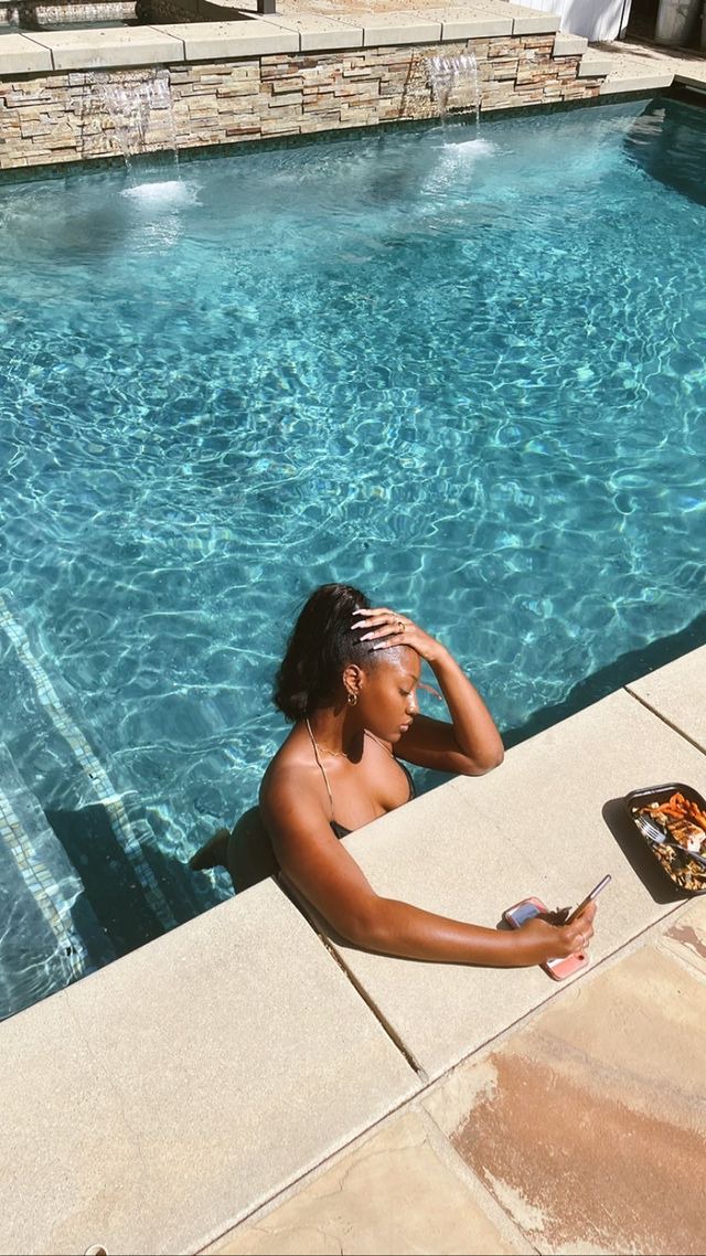 Singer, Tems shares sexy new photos of herself in a pool