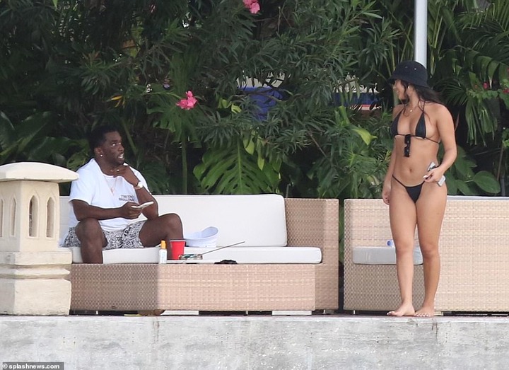 P. Diddy spotted with another mystery woman at his Miami Beach mansion few days after he was pictured kissing model Tina Louise (Photos)