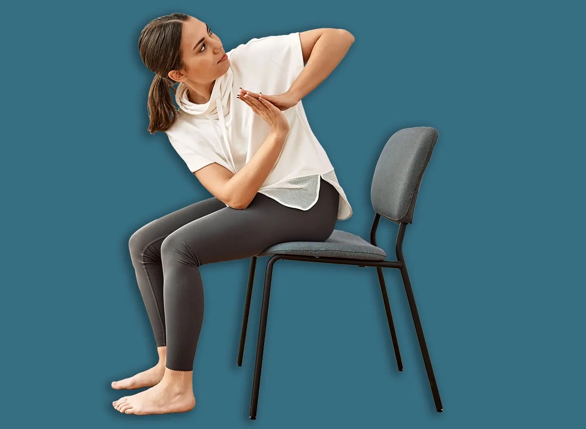 Young hispanic woman training yoga at sport center.