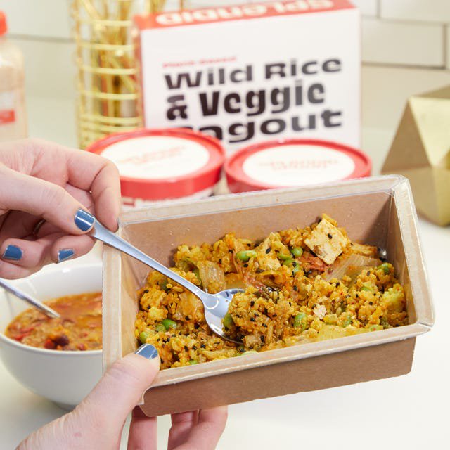 splendid spoon plantbased soup and smoothie products on a kitchen counter