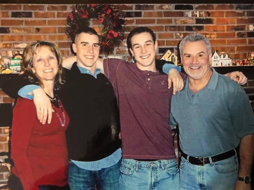 From left to right: Trish Buchanan, her son, Jared, son Ben, their husband and dad, East Hartford police officer Paul Buchanan, who died by suicide in 2013.