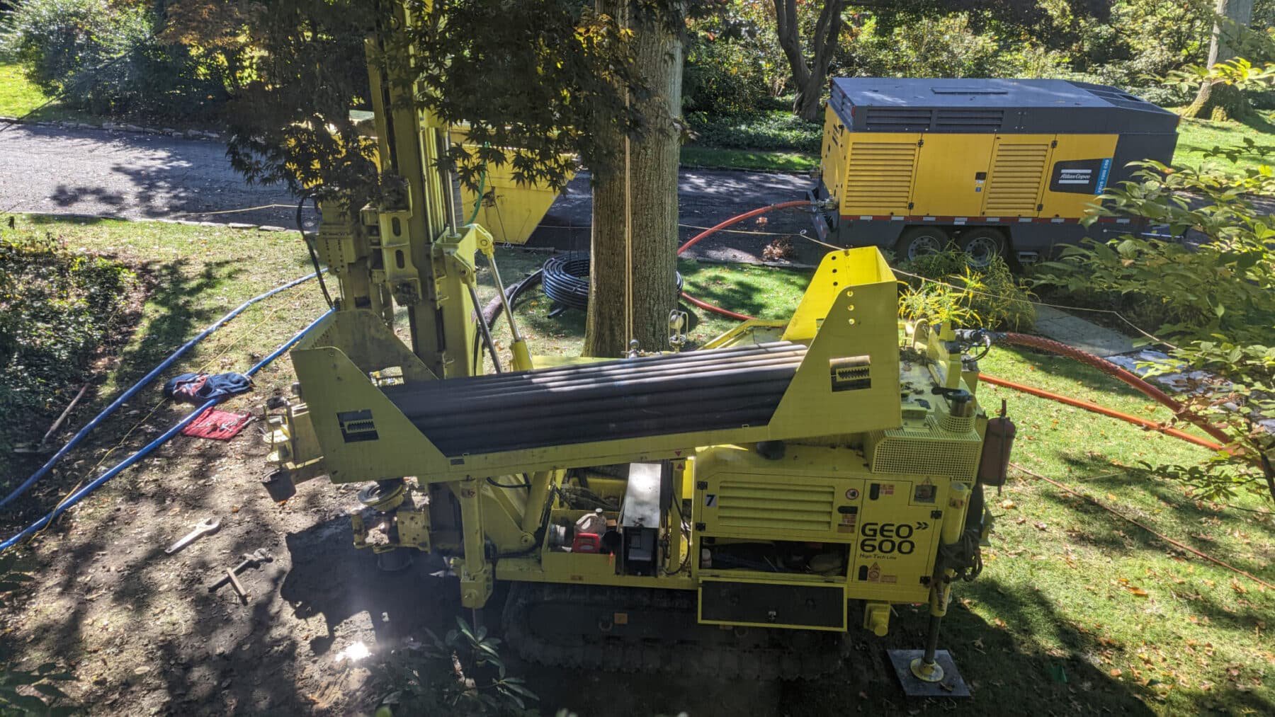 Drilling rig installing a residential geothermal well before tax credit cutoff, homeowner drilled