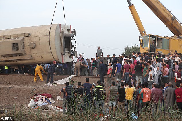 At least 11 people are killed and 100 injured as four passenger train carriages derail in Egypt?(photos)