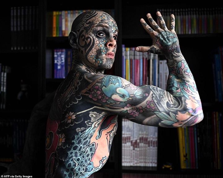  French primary school teacher who spent ?35k covering his body in tattoos is banned from kindergarten because he gives children nightmares (photos)