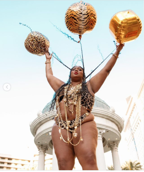 Lizzo showcases her famous curves in a tiger-print bikini to celebrate her 33rd birthday (photos)