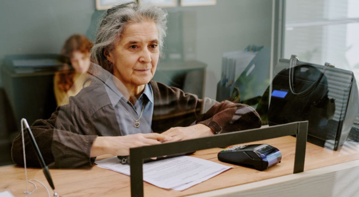Older woman at bank counter