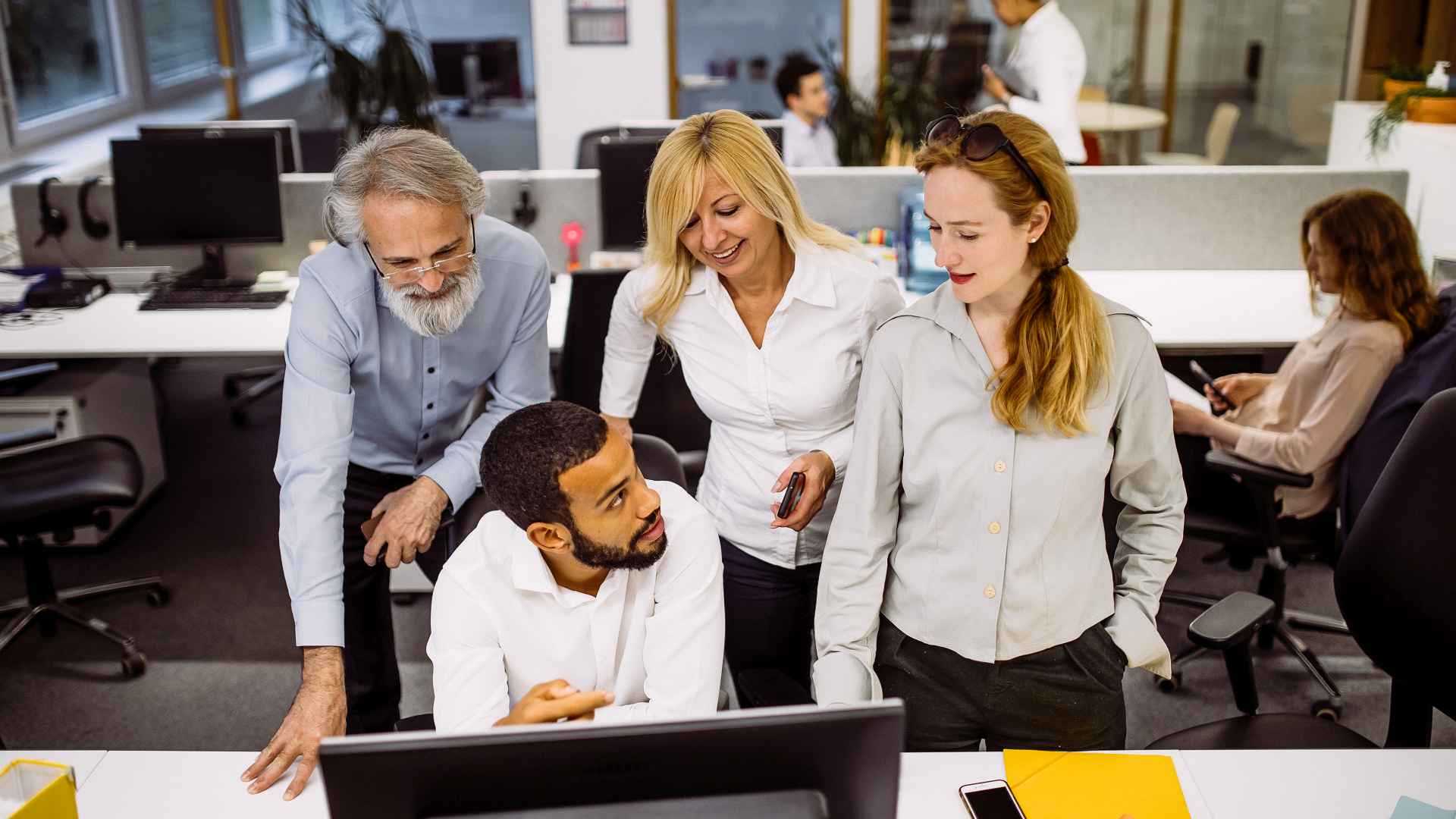 Discover all generations -- boomer, gen x, millennial, gen z working together in office discusses business plans