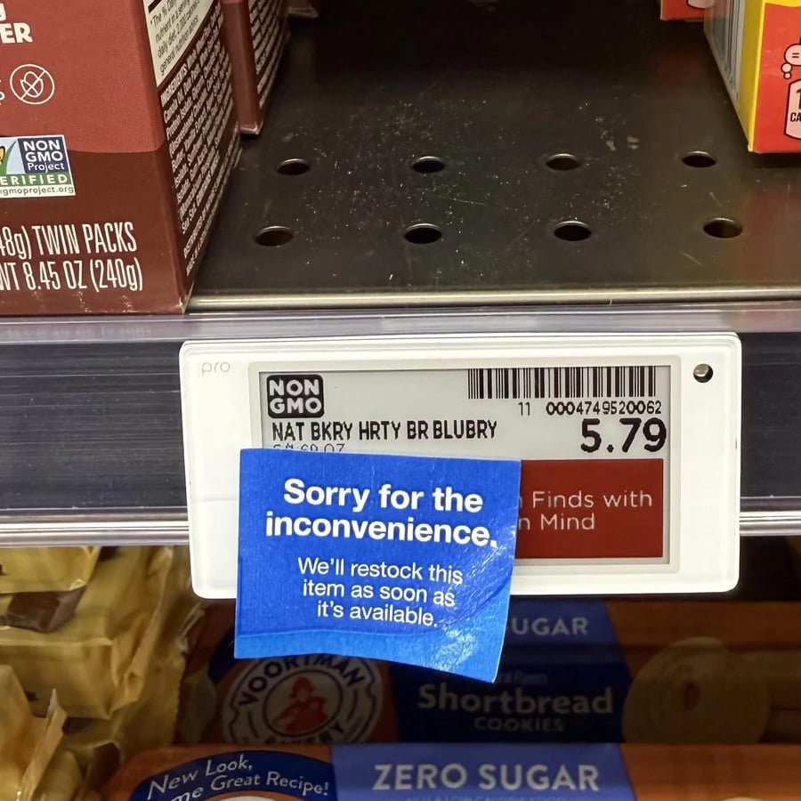 A store shelf with an empty spot for Nature’s Bakery Blueberry bars, labeled $5.79, and a blue sign saying, “Sorry for the inconvenience. We’ll restock this item as soon as it’s available.”