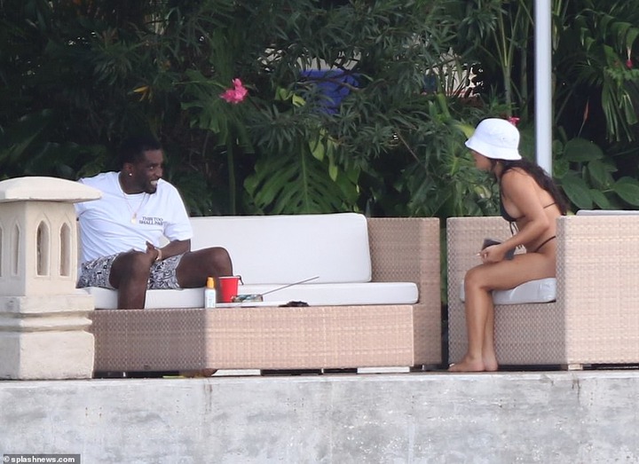 P. Diddy spotted with another mystery woman at his Miami Beach mansion few days after he was pictured kissing model Tina Louise (Photos)