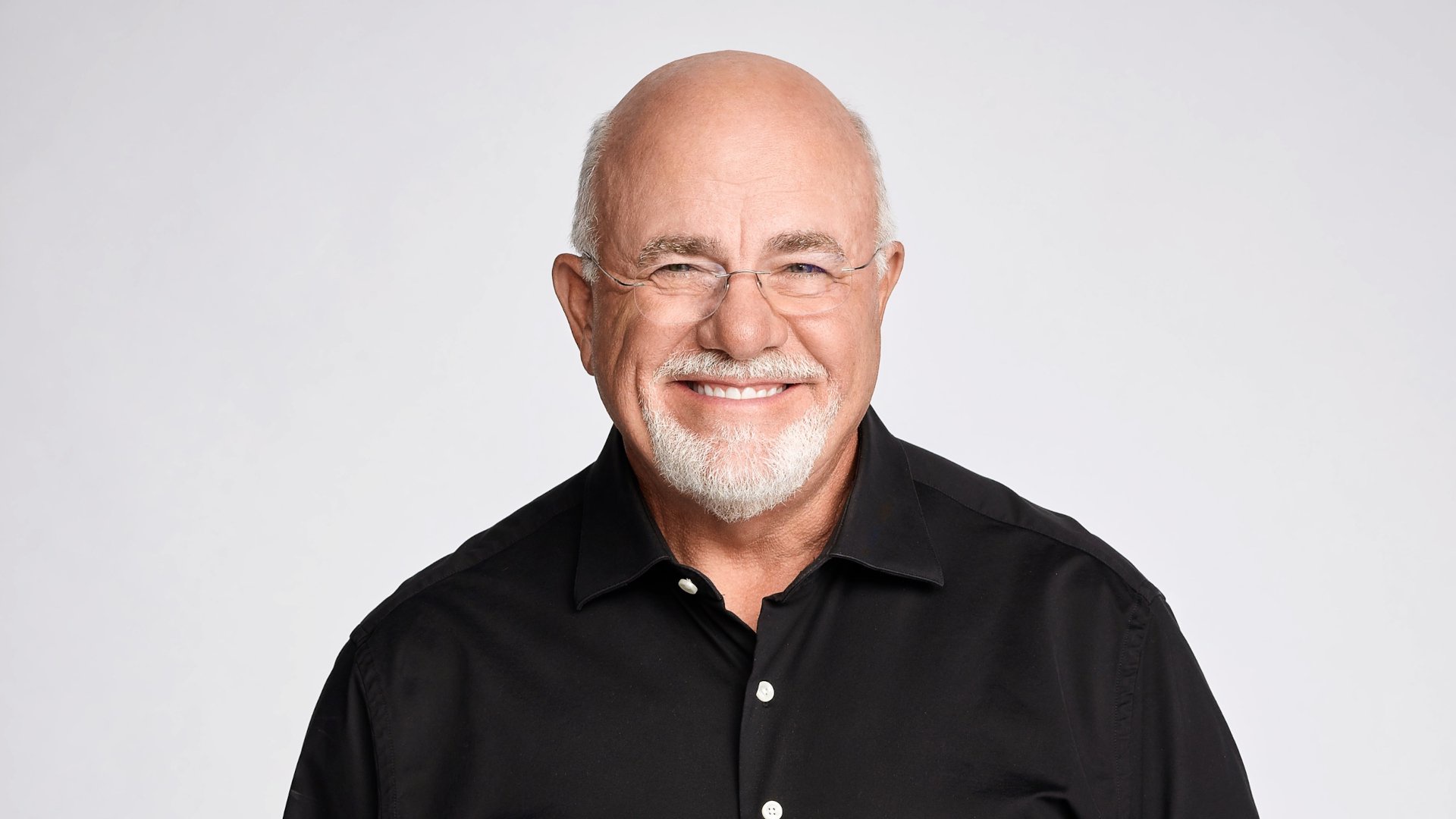 Discover a headshot of a happy Dave Ramsey, a money expert with millions of followers on his social media channels