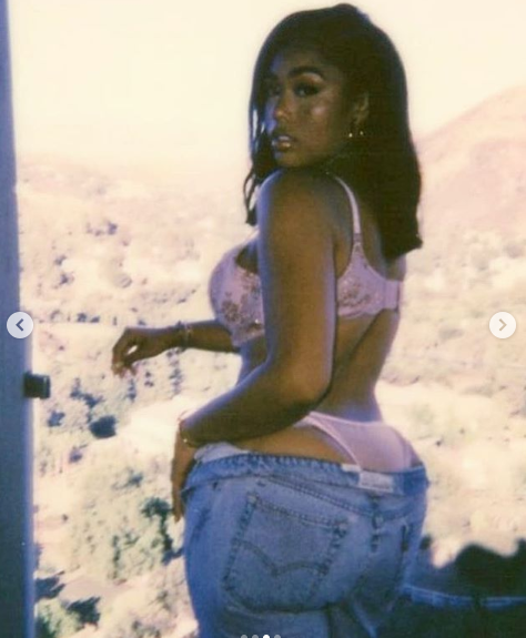 Jordyn Woods takes down her jeans to reveal her skimpy underwear in sexy new photos