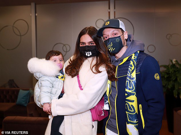 Mesut Ozil arrives in Turkey with his family ahead of his unveiling at Fenerbahce as his seven-and-a-half-year spell at Arsenal finally ends (photos)