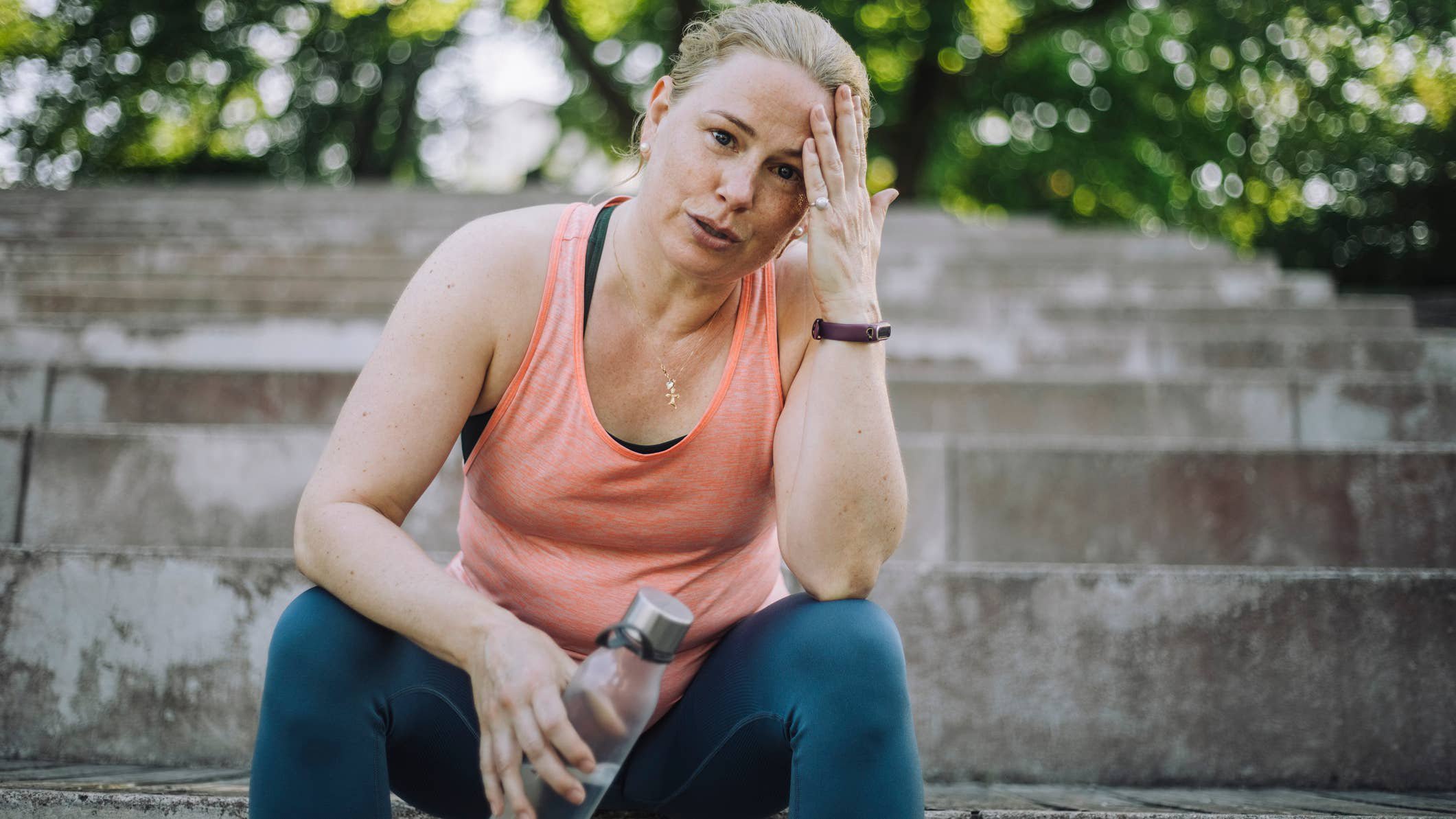 Woman exercising on stairs.