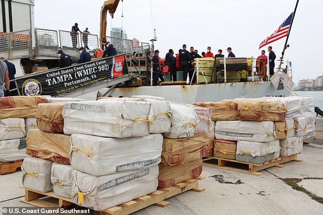 Video shows the moment coast guard members intercepted a boat carrying 5,500 pounds of cocaine worth $94.6MILLION