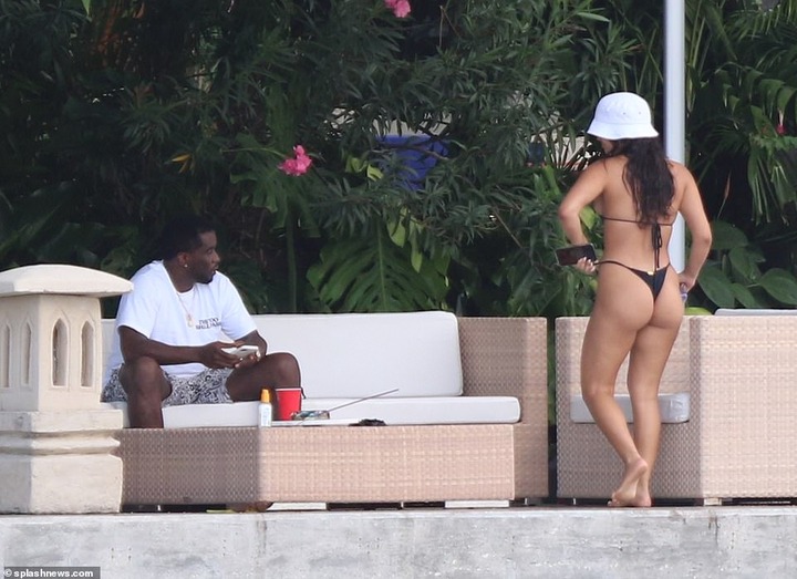 P. Diddy spotted with another mystery woman at his Miami Beach mansion few days after he was pictured kissing model Tina Louise (Photos)