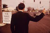 A businessman in Beaverton, Oregon, hitchhikes due to high gas prices in 1973.