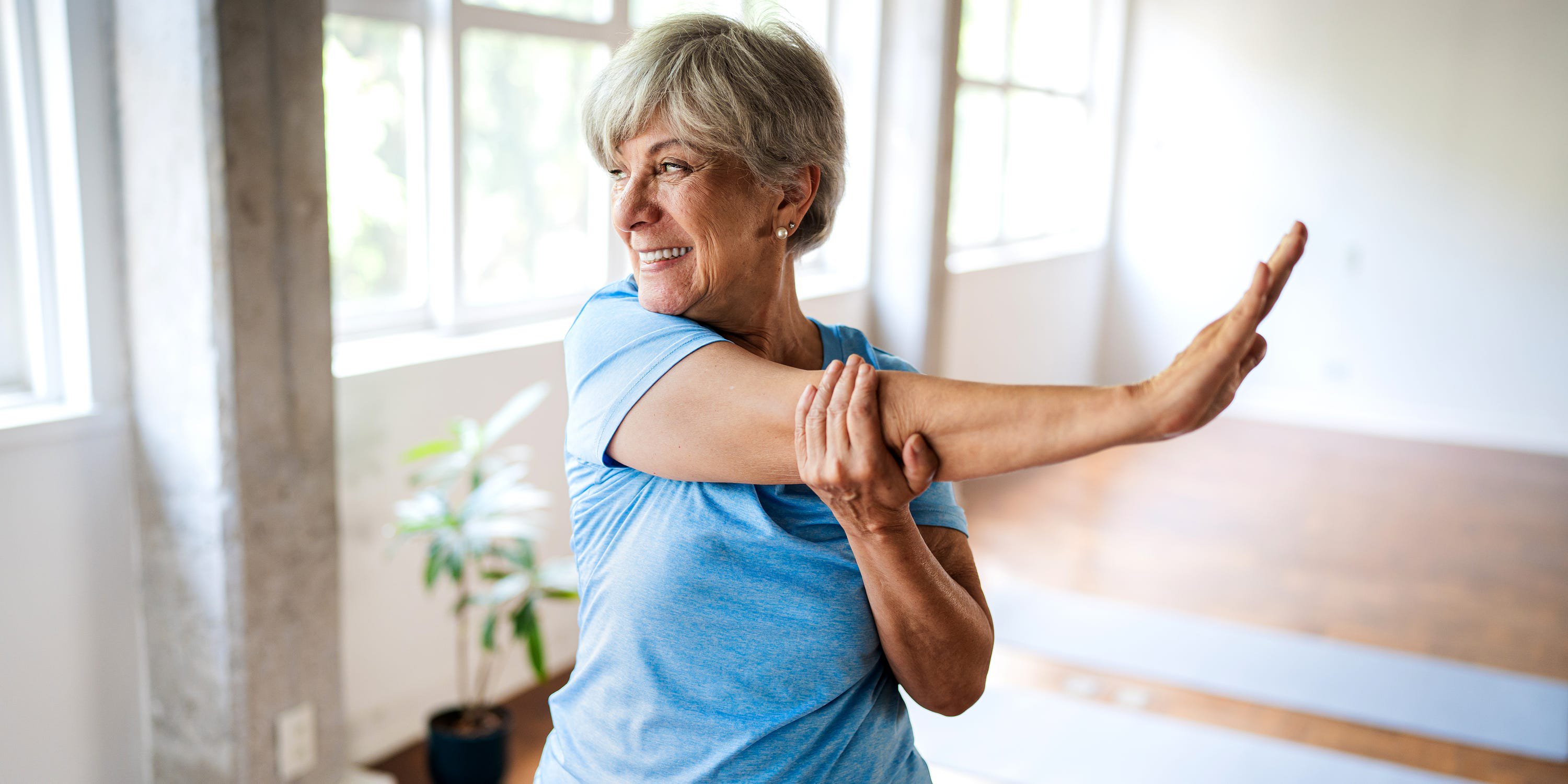 An older woman stretching