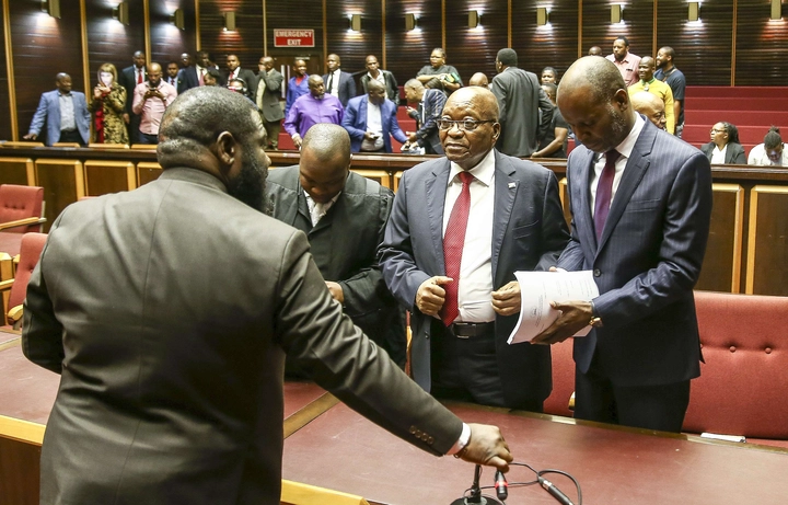 a group of people standing next to a man in a suit and tie: Former president Jacob Zuma in court with his legal counsel. Zuma and French company Thales' application for a permanent stay of prosecution was dismissed by the Pietermaritzburg High Court. File picture: Leon Lestrade/African News Agency(ANA).