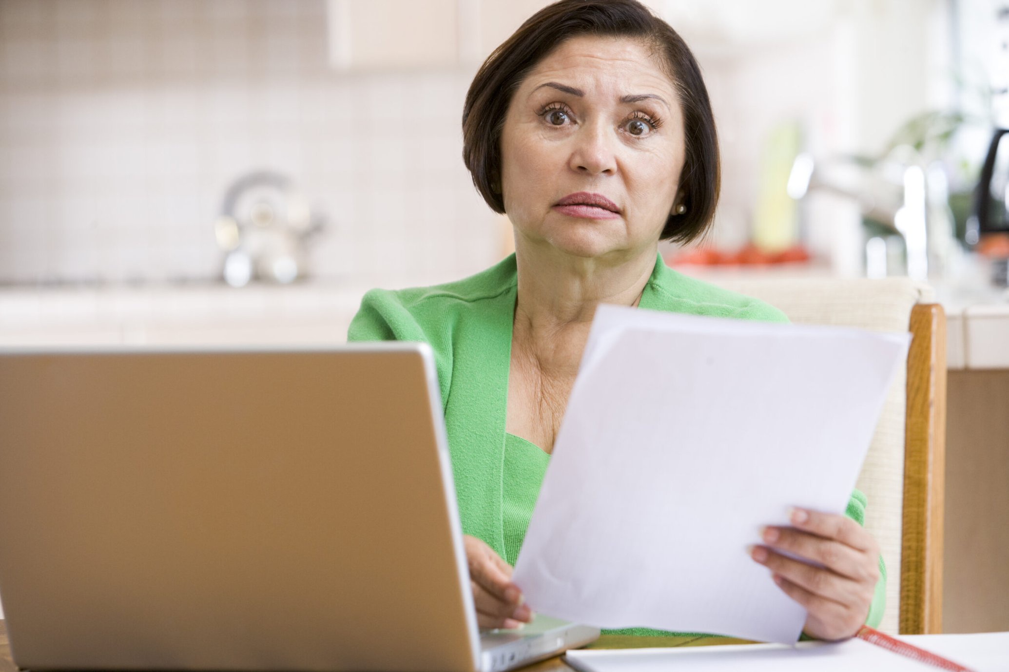 Worried woman with bills
