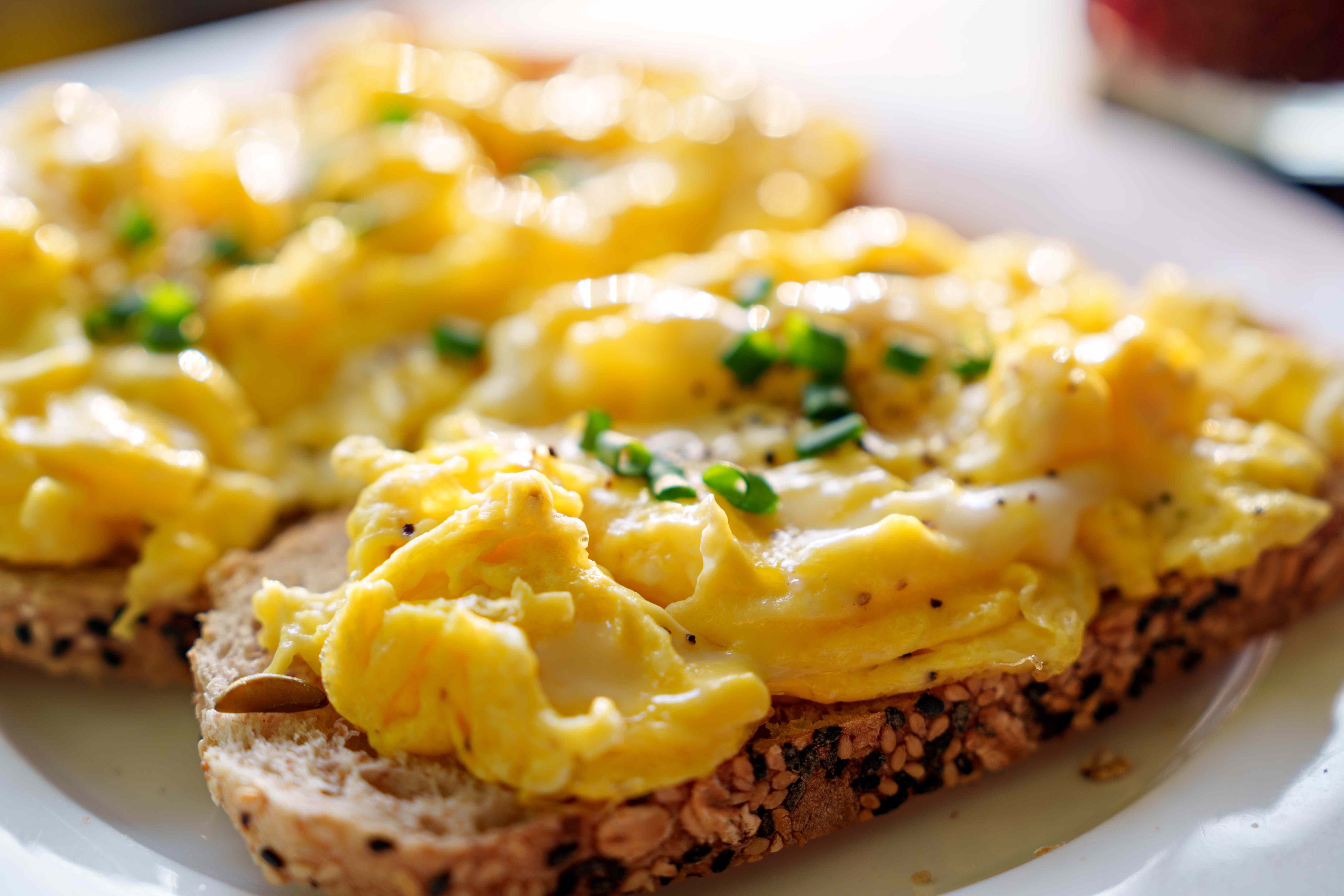 Adding eggs to toast can help prevent a drastic blood sugar spike.Credit: Thai Liang Lim / Getty Images