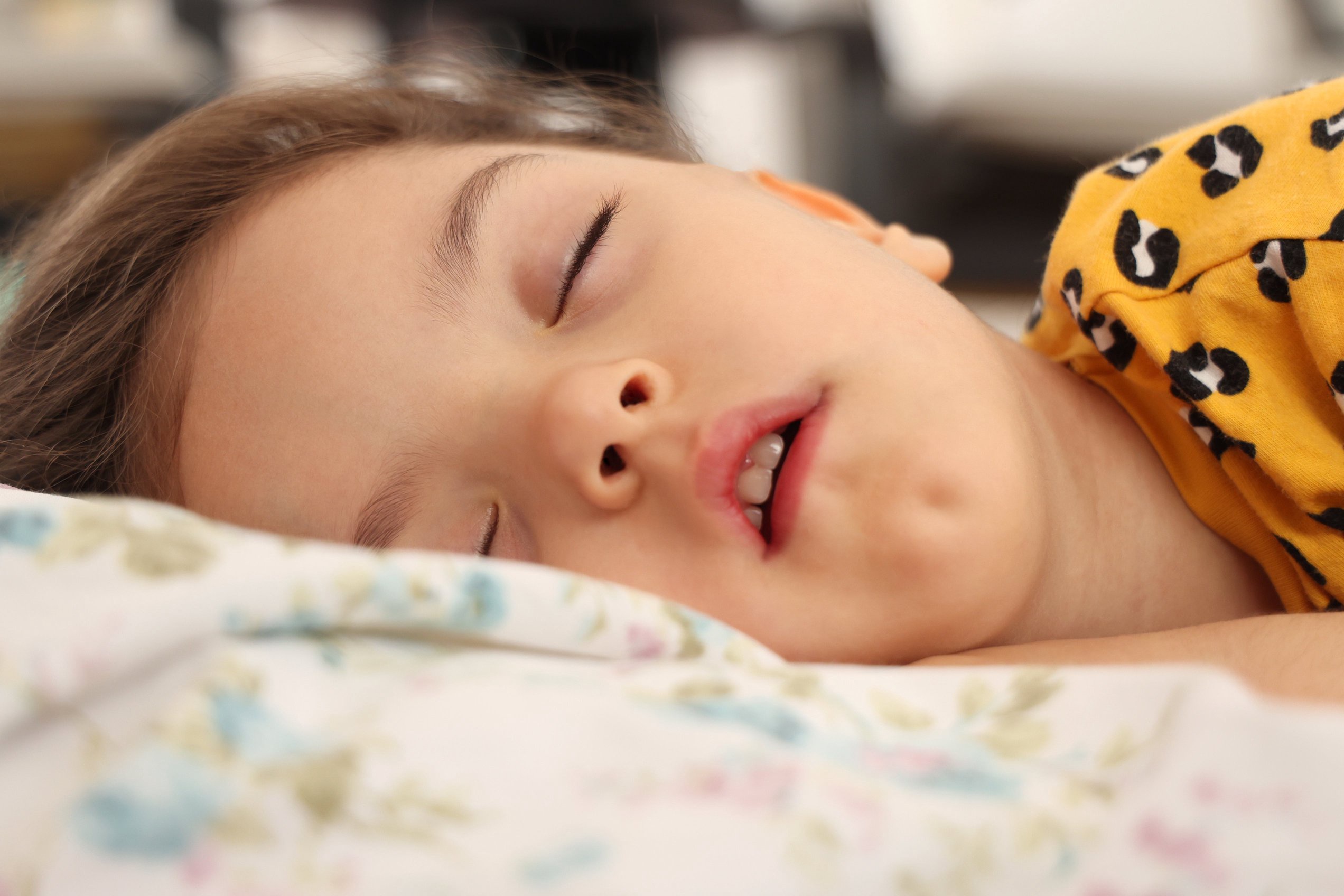 Child peacefully sleeping on a pillow