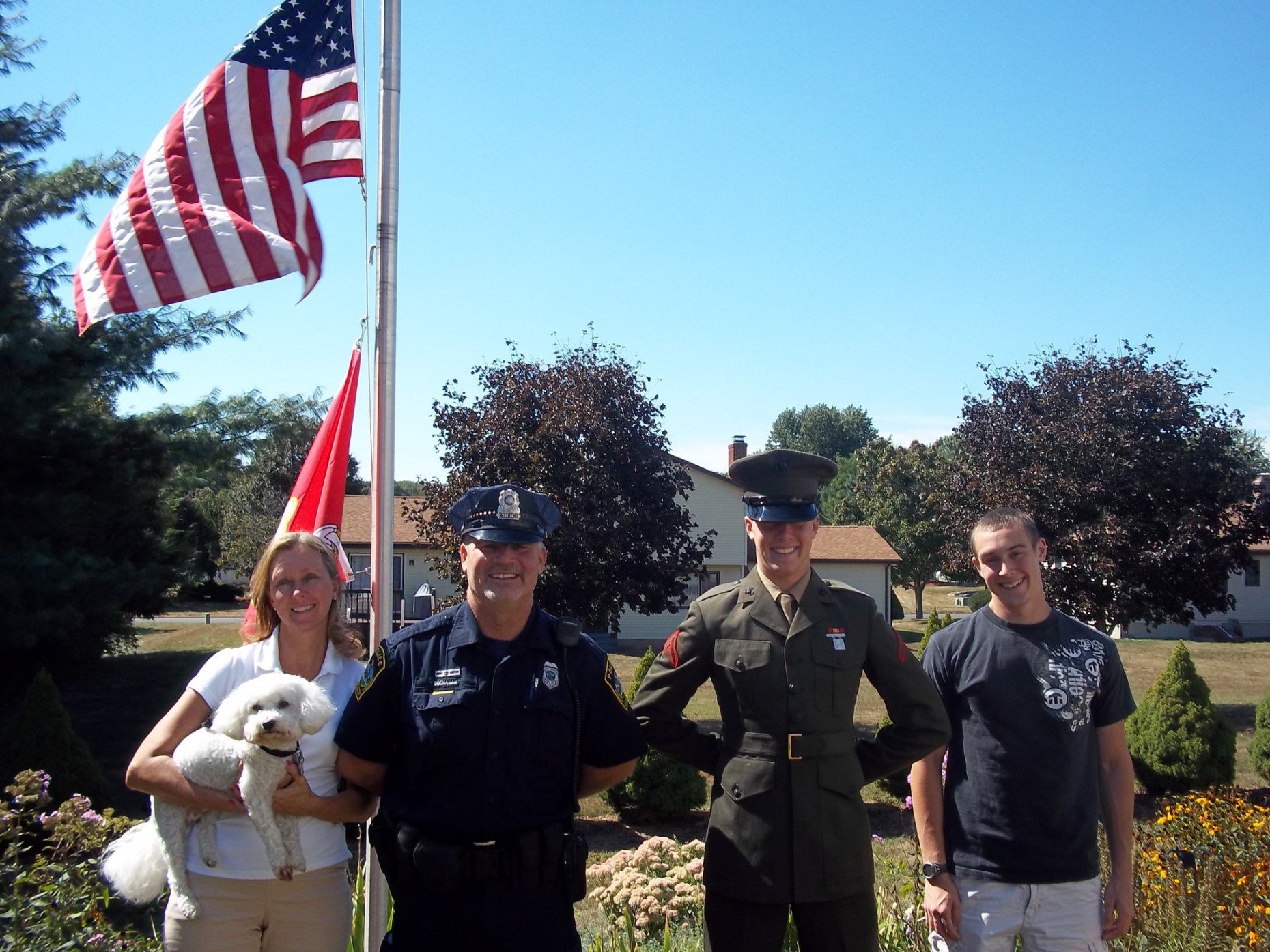 East Hartford Police Officer Paul Buchanan with wife, Trish, and sons, Jared and Ben (right).