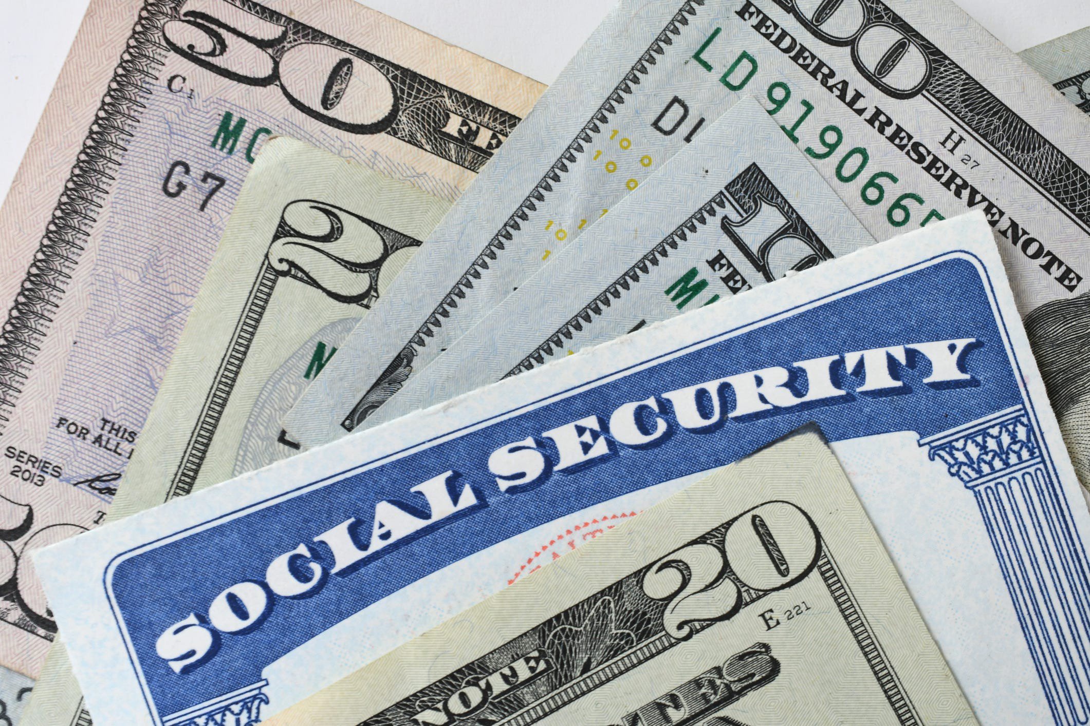 Social Security Card with cash money dollar bills