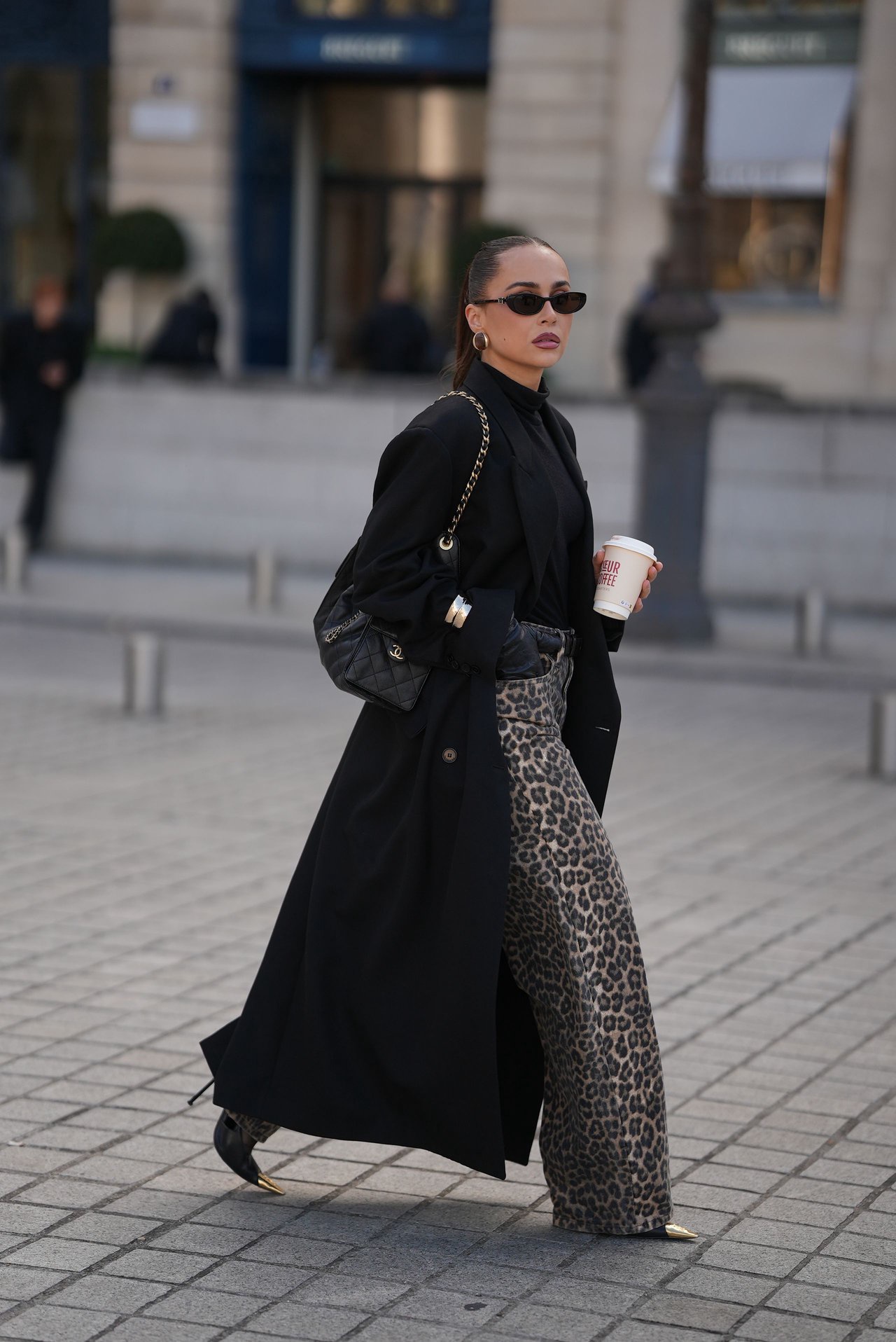 Image may contain Clothing Coat Pedestrian Person Accessories Bag Handbag and Overcoat