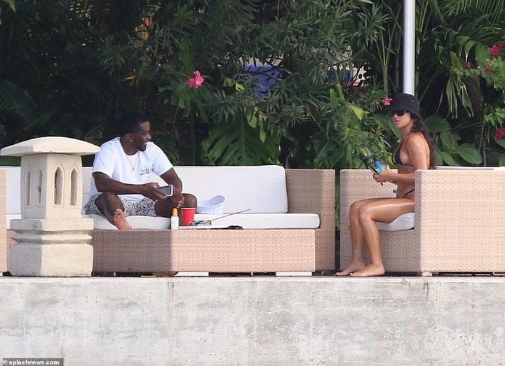 P. Diddy spotted with another mystery woman at his Miami Beach mansion few days after he was pictured kissing model Tina Louise (Photos)