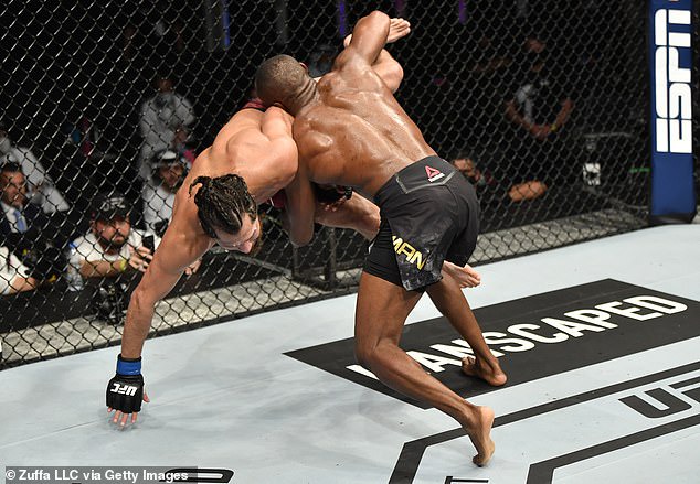 Nigerian UFC star, Kamaru Usman retains his Welterweight title by unanimous win after beating Jorge Masvidal (Photos)