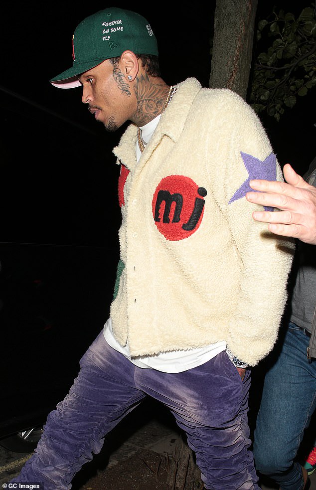Chris Brown spotted with rumored girlfriend Gina Huynh during night out in London ?(photos)