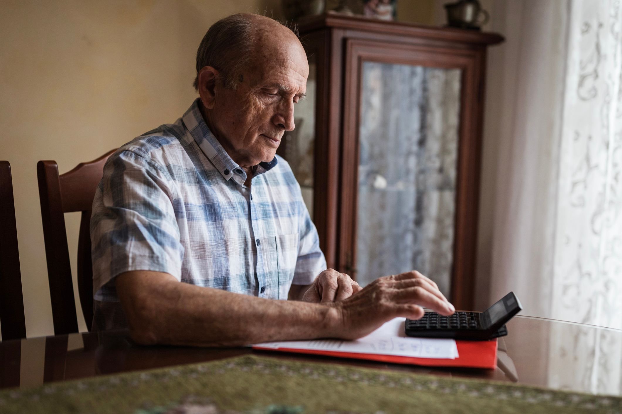 A person using a calculator
