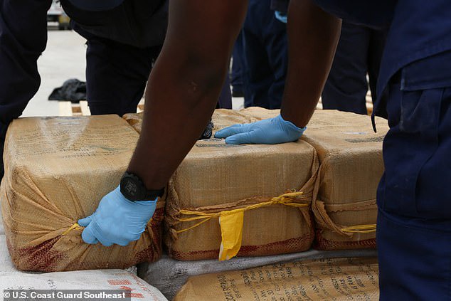 Video shows the moment coast guard members intercepted a boat carrying 5,500 pounds of cocaine worth $94.6MILLION