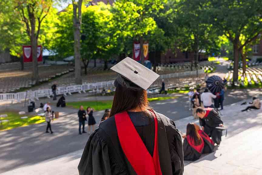 Graduation students, faculty, and family gather in Harvard Yard on May 28, 2025, in Cambridge, Massachusetts.  (Spencer Platt/Getty Images/TNS)