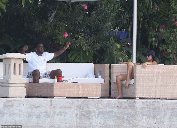 P. Diddy spotted with another mystery woman at his Miami Beach mansion few days after he was pictured kissing model Tina Louise (Photos)