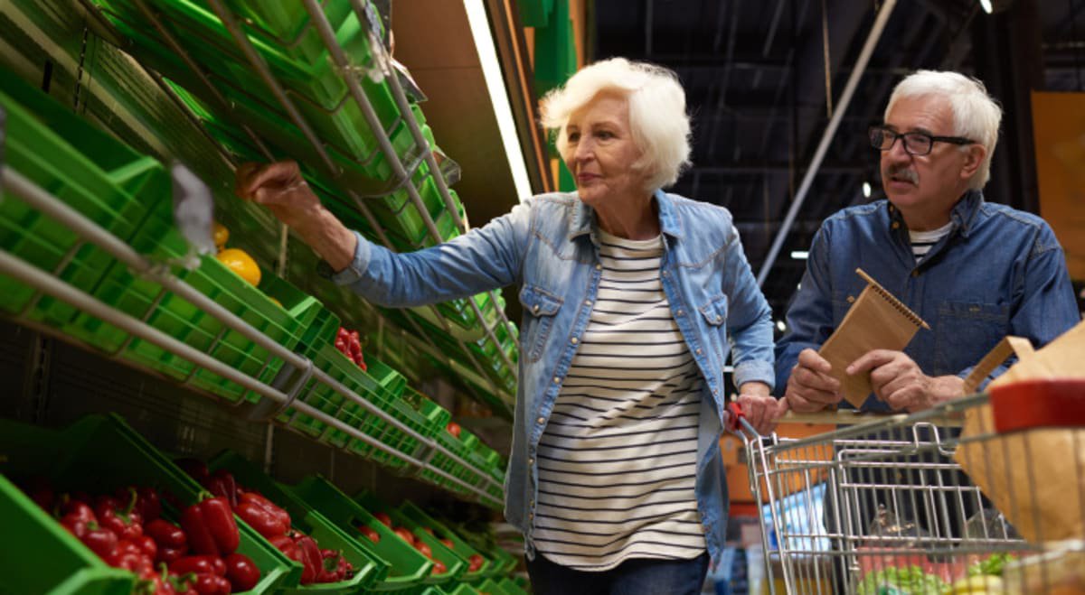 Senior couple buying groceries