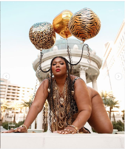 Lizzo showcases her famous curves in a tiger-print bikini to celebrate her 33rd birthday (photos)