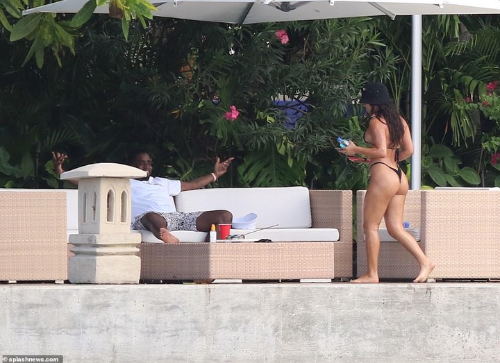 Hip-pop mogul, Diddy spotted with mystery woman at his Miami Beach mansion days after he was pictured kissing model Tina Louise (Photos)