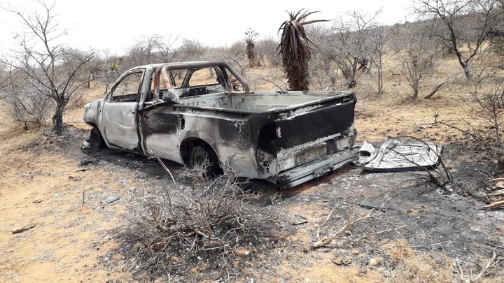 A car which belonged to one of the men was torched not far from the scene.