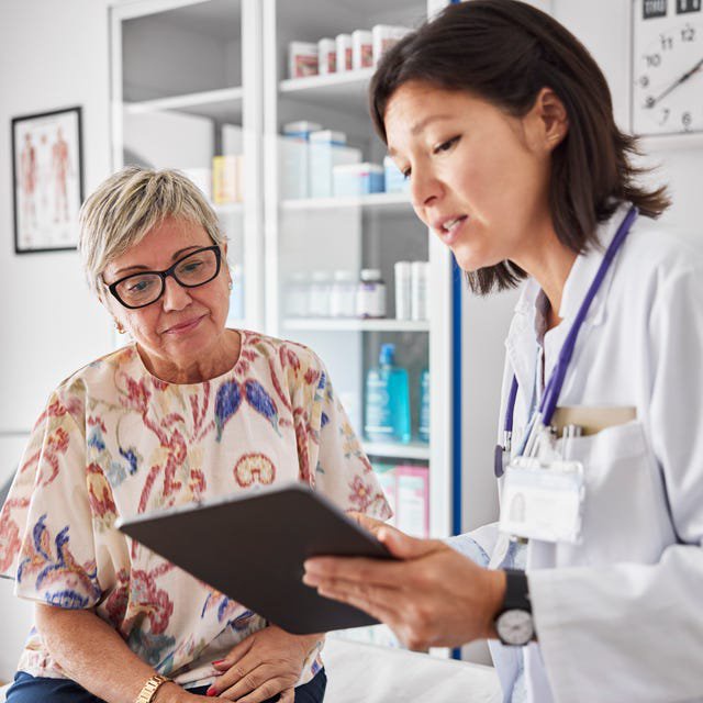 Doctor sharing medical results with woman
