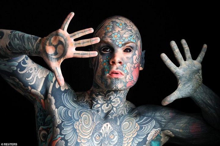  French primary school teacher who spent ?35k covering his body in tattoos is banned from kindergarten because he gives children nightmares (photos)