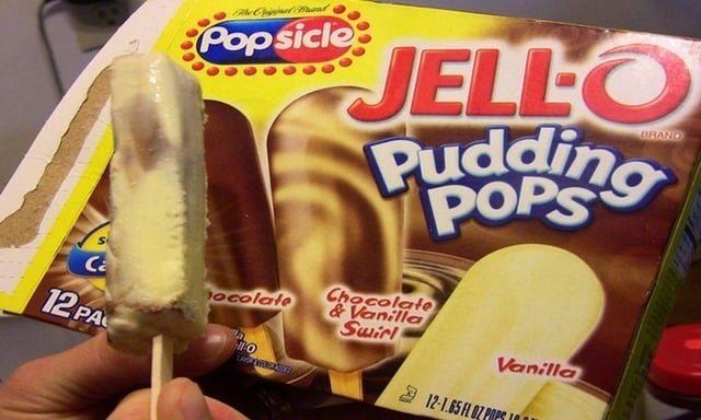 Box of Jell-O Pudding Pops with vanilla, chocolate, and chocolate-vanilla swirl flavors. Close-up of a handheld Popsicle