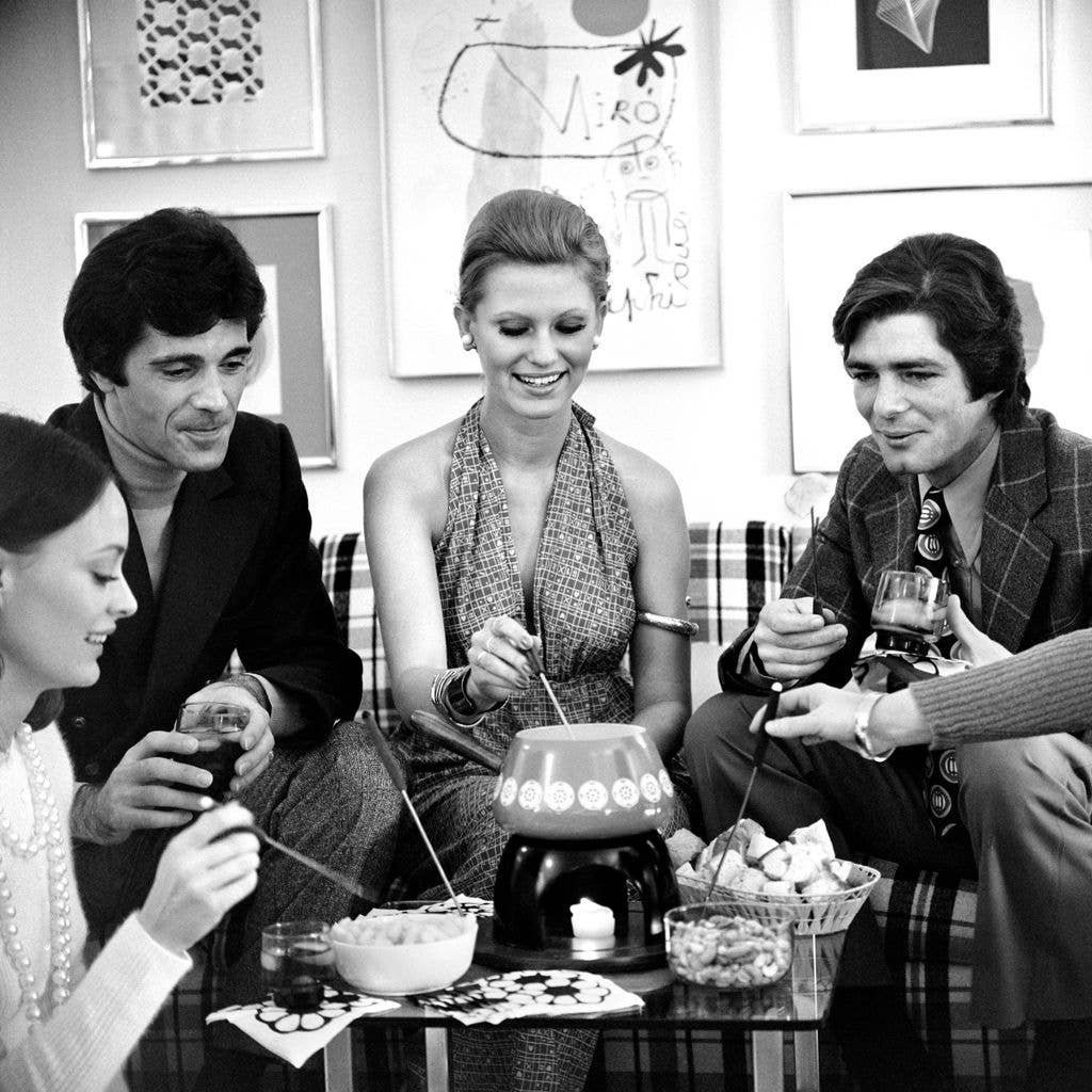 1970s fondue party with several couples.