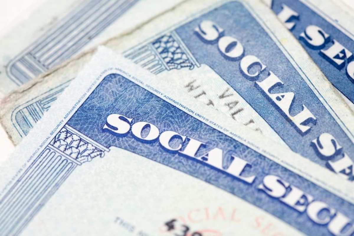 Close-up of overlapping U.S. Social Security cards