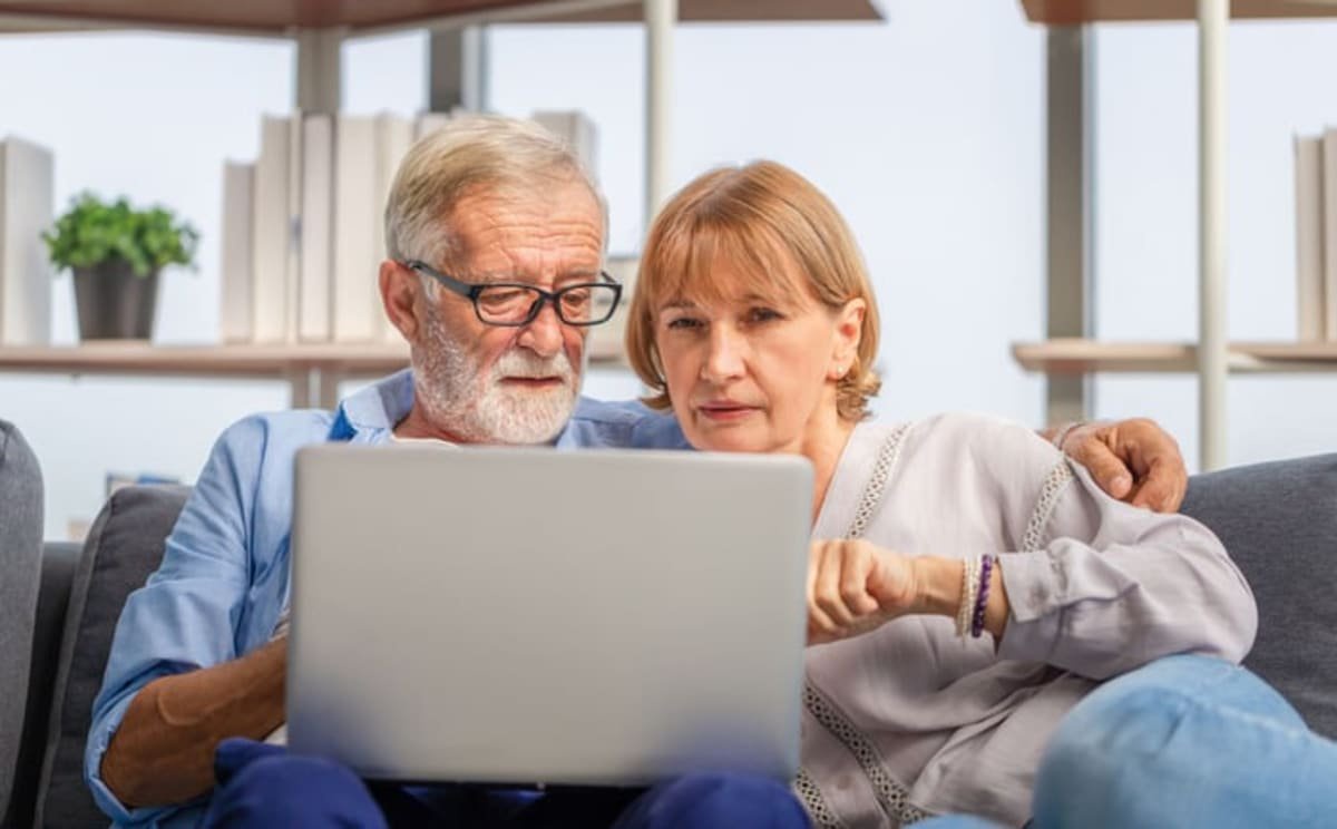 Two people at a laptop
